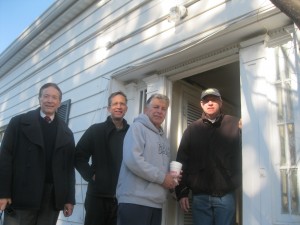 Bill Primavera, Jean-Francois de Laperouse, Councilman Nick Bianco and Yorktown Historical Society President Paul Martin outside of the Federal-style doorway.