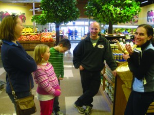 Allison Stowell (right) walked with the Wiegelman family of Somers around Hannaford Supermarket in Carmel to teach them how to shop healthier.