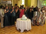 Honorees and ceremony particiapants sing "Happy Bithday" to Girl Scouts.