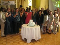 Honorees and ceremony participants sing "Happy Birthday" to Girl Scouts.