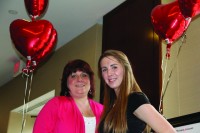 Katarina WEigel (right) with her mom at the American Heart Association Go Red Luncheon in 2011.