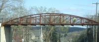 PutCoNoOne3 | The Examiner News A bicyclist glides across the bike path bridge that spans over Route 6.