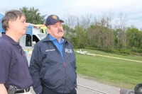 Yorktown Police Chief Daniel McMahon (right) with a representative of the Westchester Police Department on the scene of the plane crash in Yorktown.