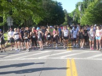 About 150 runners line up early Sunday morning for the start of the New Castle 10K race.