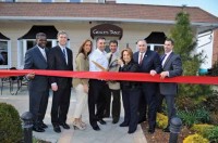 (Left to right) County Legislator Ken Jenkins, White Plains Mayor Tom Roach, co-owners Pina Soares, Joe Trama, Dino Doria, and Grace Doria and Assemblyman Bob Castelli join co-owner Joe Doria at a ribbon cutting in April.