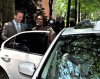 County Executive Rob Astorino helps ParaTransit rider Robin Jones, a White Plains resident, into a taxi on Tuesday, May 29.