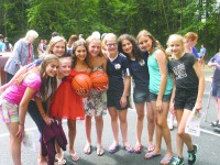 Angelie Tomais and Catherine Mazza pose with friends at unveiling of “Hoops 4 U” basketball court last week.