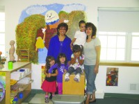2012 NWE 0918 BOW Once Upon A Time 3 Lisa Montalto-Rodrigues (left) and Vera Iaconis pose with some of the children at Once Upon A Time preschool in Putnam Valley.