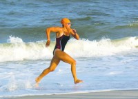 Caren Guyett sprints from the ocean at Long Beach Island.