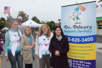 Dr. Delaney Acosta (far right) and her staff work hard to make their young patients feel comfortable receiving dental care.