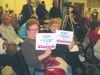 Maria Flotta and Terry Read, who combined have lived in Yorktown more than 90 years, show their support for Costco at public hearing Monday night.