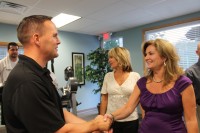 Brian Kelly greets County Executive MaryEllen Odell.