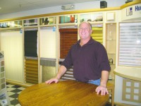 Pat Viverito poses in showroom of Niles Floors and Window Fashions.