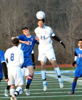 Carmel's Austin Mayhew and Mahopac's David Kalaj get after it in Monday's Class AA quarterfinal action. | The Examiner News