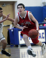 Fox Lane's Nick Bonura takes the ball to the basket in Saturday's game vs. Brewster. Photo by Andy Jacobs