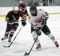 Jack Richter of Fox Lane carries the puck toward the Ossining goal in Sunday's game. Photo by Andy Jacobs