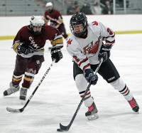 1-29Foxes2-Jack Richter | The Examiner News Jack Richter of Fox Lane carries the puck toward the Ossining goal in Sunday's game. Photo by Andy Jacobs