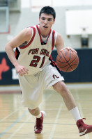 Fox Lane's center Tommy Palmerton drives to the basket in Friday's game versus Briarcliff. Photo by Andy Jacobs