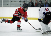 Brian Cohen of Fox Lane sends a slap shot towards the net in Sunday's game at the Brewster Ice Arena. Photo by Andy Jacobs.