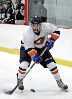 Ryan Katchis of Greeley moves the puck up the left wing in Sunday's victory over Brewster. Photo by Andy Jacobs