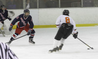 Despite Tigers’ Kevin McGee's one goal and two assists his team lost in overtime 6-5 to Rye. Photo by Billy Becerra