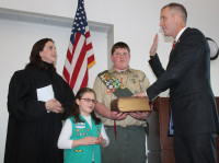 As Hon. Maria Rosaswore Rep. Sean Patrick Maloney in Emily
and Boy Scout Sean Terwilliger hold the
bible.