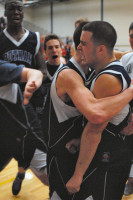 Class B Putnam Valley players, who had a trying week off the court, rush to congratulate Tiger junior Kevin Fitzsimmons after his game-winning shot beat the buzzer in overtime during a 56-55 win over host Class AA Carmel last Monday. Photo by Ray Gallagher