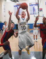 Mahopac's John Delehanty (10) was one of several Indians to spark Mahopac off the bench in its 83-57 win over Peekskill (10-3) in Saturday's Westchester/Putnam Coaches vs. Cancer series where state-ranked (No.10) Class A Red Devils Dan Casey (L) and Musheed Muhammad (R) were no match for the surging Indians (11-3), who have won six-straight games. Photo by Ray Gallagher