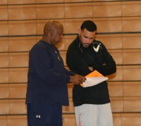 WPHS Photo 1-Tigers Head Coach Spencer Mayfield (left) makes a point to his volunteer assistant coach David Zenon (right) at practice, on Thursday, Jan. 17, at White Plains High School. Photo by Albert Coqueran