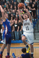 Mahopac’s Brendan Hynes goes for two of his 26 points in 60-47 win over Carmel Saturday at Mahopac. Photo by Ray Gallagher