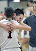 2-19Byram4-Brian Skelly | The Examiner News An emotional Brian Skelly hugs teammate Justin Pollack after the Bobcats' miraculous playoff victory Friday. Photo by Andy Jacobs