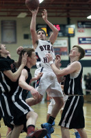 Byram Hills forward Ryan Golden shoots a fallaway jumper over three Rye players in Friday's Bobcat victory. Photo By Andy Jacobs