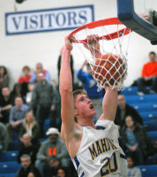 Mahopac senior C John Vitkus assaults the iron with a vicious two-handed flush in the fifth-seeded Indians' 61-31 triumph of visiting No.12 Mamaroneck in last Friday opening round of the Section 1 Class AA basketball tournament. Photo by Ray Gallagher