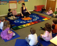 Emily Flay leads a class at The Children's School of Yoga in Pleasantville. 