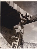Alfred Bush, as a Frank Lloyd Wright apprentice, building Taliesin West in Scottsdale, Ariz. Later he served as a model for the Atlas sculpture at Rockefeller Center.