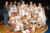 Members of the Ossining girls basketball team pose with their third consecutive gold ball Sunday at the Westchester County Center.