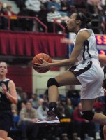 Ossining G Saniya Chong soars to rack for two of her 39 points in the Pride’s 83-51 Section 1 Class AA title-clinching win over Lourdes to complete the three-peat last Sunday at the Westchester County Center.