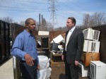 Westchester County Executive Rob Astorino and facility manager Lee Brannan stood at the county’s Household Materials Recovery Facility in Valhalla on April 11. Astorino and other county officials celebrated the first anniversary of the facility.