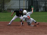 Frame 1 | The Examiner News On a controversial umpire’s call in the sixth inning of the White Plains versus New Rochelle game on Thursday. The Tigers scored four runs after Kyle Adams (sliding) was called safe stealing second, which would have been the third out of the inning. Huguenots shortstop John Valente (left) has the ball in his glove, while Adams hook-slides into second base. Tigers won 5-1. Photo by Albert Coqueran