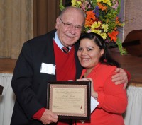 Former Mayor Joseph Delfino presenting the Delfino Scholarship award to Jennifer Salazar of White Plains.