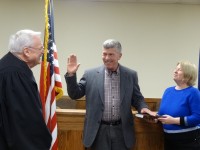 Trustee Bruce Campbell is sworn in by Cold Spring Village Justice Thomas Costello