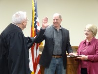 Newly-elected Mayor Ralph Falloon was sworn in Monday night by Cold Spring Village Justice Thomas Costello