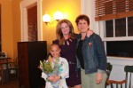 Calvin Powell, a PARC Preschool graduate, and PARC Preschool staff member Marie Raptis (right) present flowers to Putnam County Executive MaryEllen Odell, during the meeting of the Putnam County Legislature on May 1.