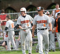 Tigers Head Coach Marcel Galligani (right) and his Team Captain catcher Kyle Adams (left) try to figure out how to approach the plate and muster some offense against the Raiders, on Friday, May 10.  Photo by Albert Coqueran 