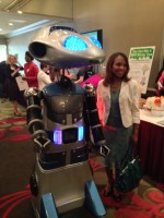 Millennia the robot, was very social during the networking portion of Friday’s YWCA event. She was seen chatting with almost every one of the 500 attendees. Next year she might be seen wearing  YWCA’s Persimmon.