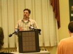 Department of Environmental Conservation biologist Kevin Clarke speaks to concerned residents at a special May 29 forum in Chappaqua about how they can protect themselves and their pets from coyote attacks.