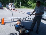 Trixie, the trained bed bug sniffing dog, checks bundles of books Saturday in Chappaqua.