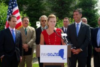 Putnam County Executive MaryEllen Odell speaks at a press conference held before a forum for PAYGo NY, an initiative spearheaded by Ulster County Executive Mike Hein (front right). 