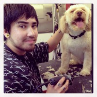 Daniel Garrido of Glam Star Grooming with a happy spa customer.