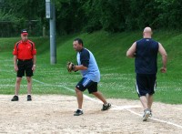 Elements Captain Chris Brown makes the play at first base on Dingleberries Dennis Delango running down the line, in Elements’ 9-6 win over Dingleberries, at Leslie B. Gillie Park. Photo by Albert Coqueran